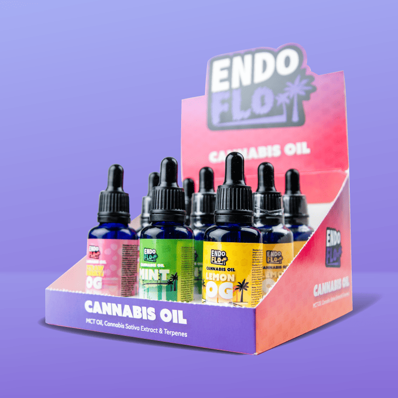 endoflo mixed 9 pack of full spectrum cbd oils in counter top display unit with purple background